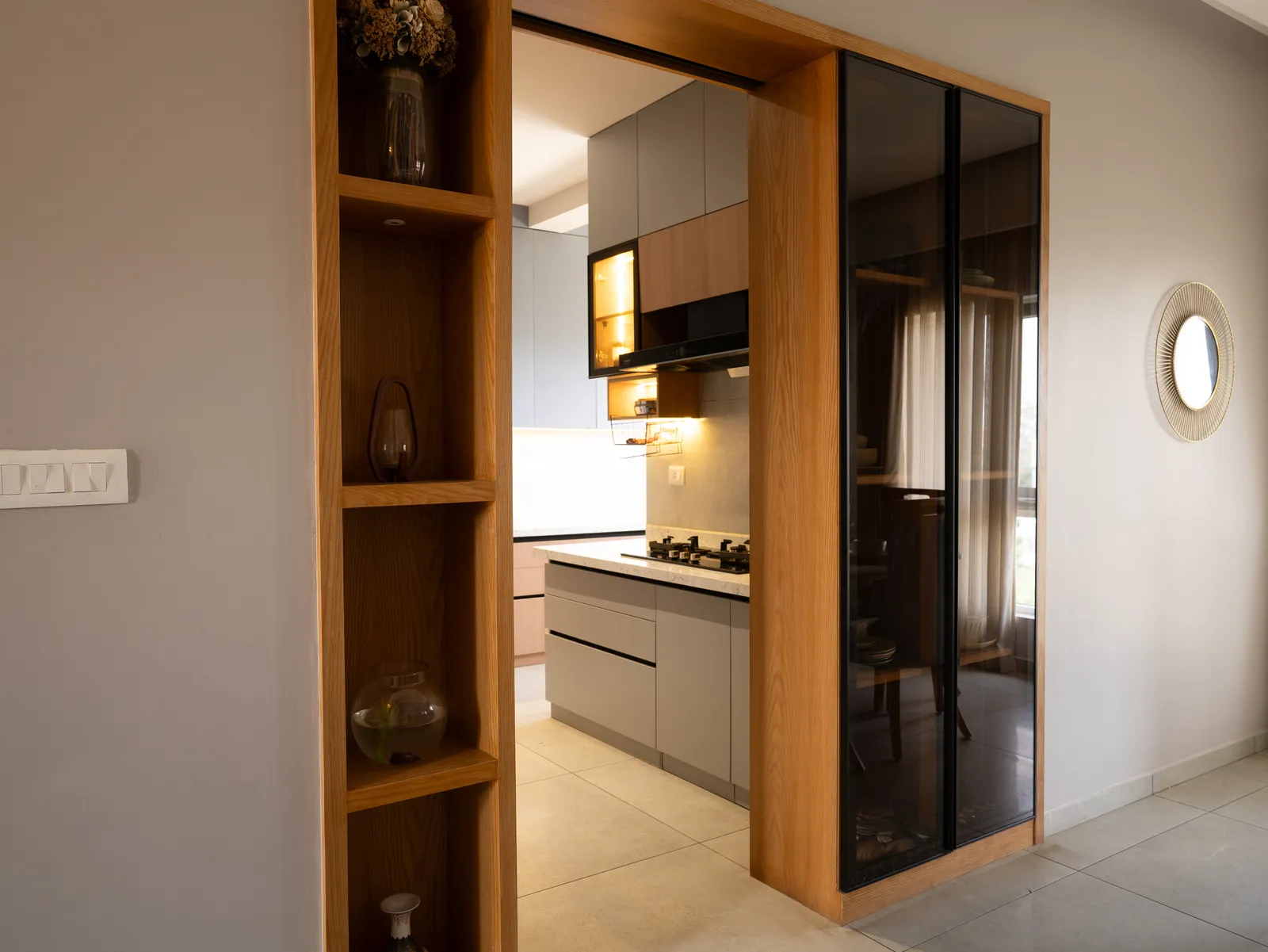 Oak display shelf and black glass kitchen door — Amlan's Residence